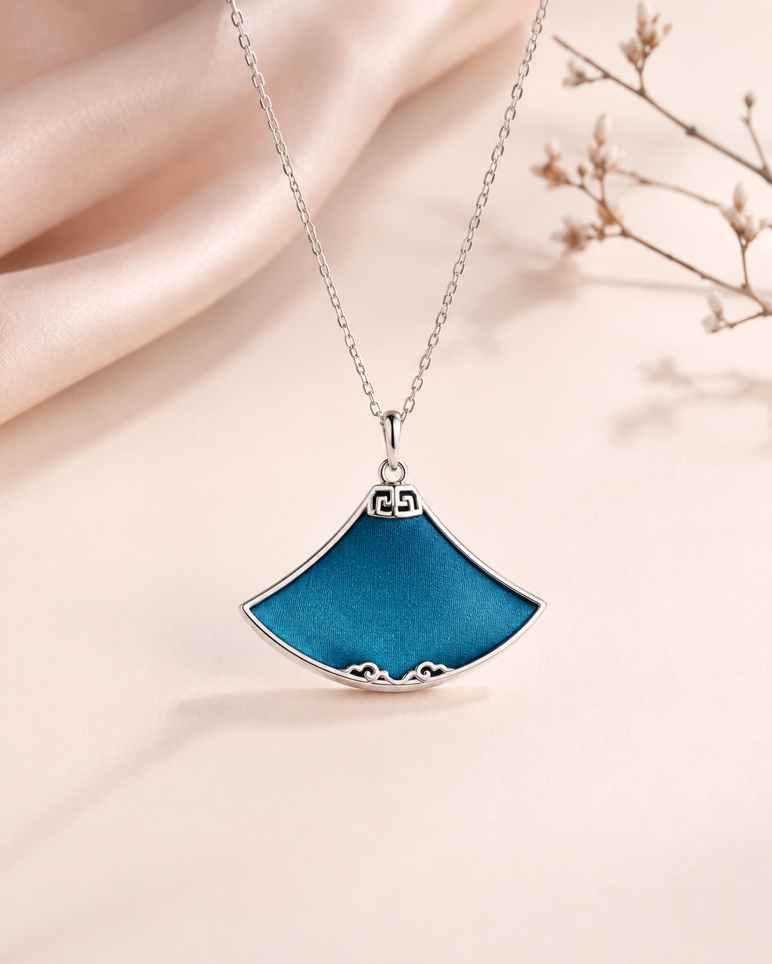 Fan-shaped pendant necklace with solid peacock blue silk and silver-tone metal frame