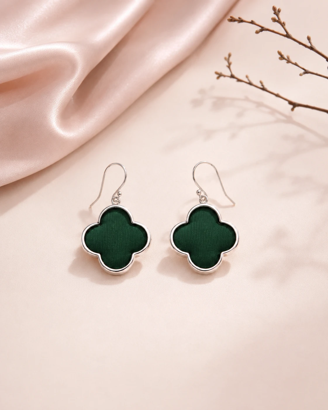 Flower-shaped earrings with solid dark green silk and smooth silver-tone metal frames