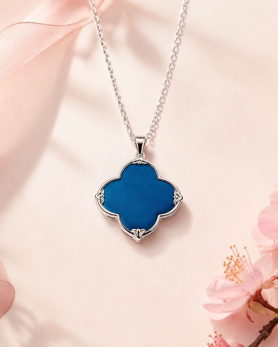 Flower-shaped silk pendant necklace with solid peacock blue silk and silver-tone border