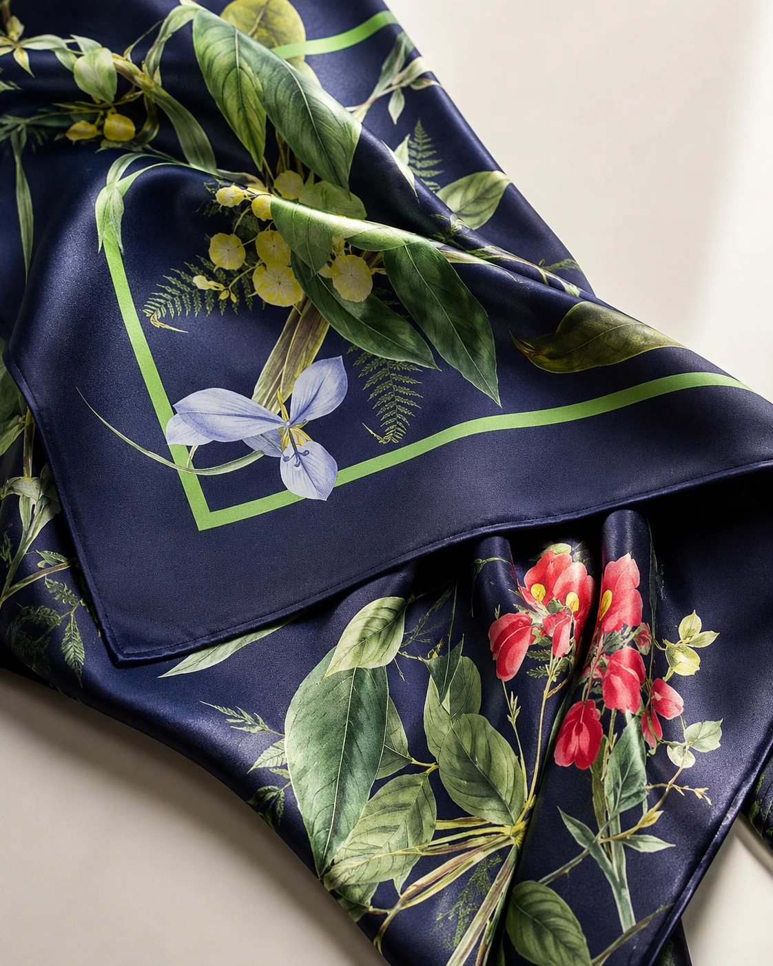 Navy silk scarf with botanical printed pattern and luxury texture