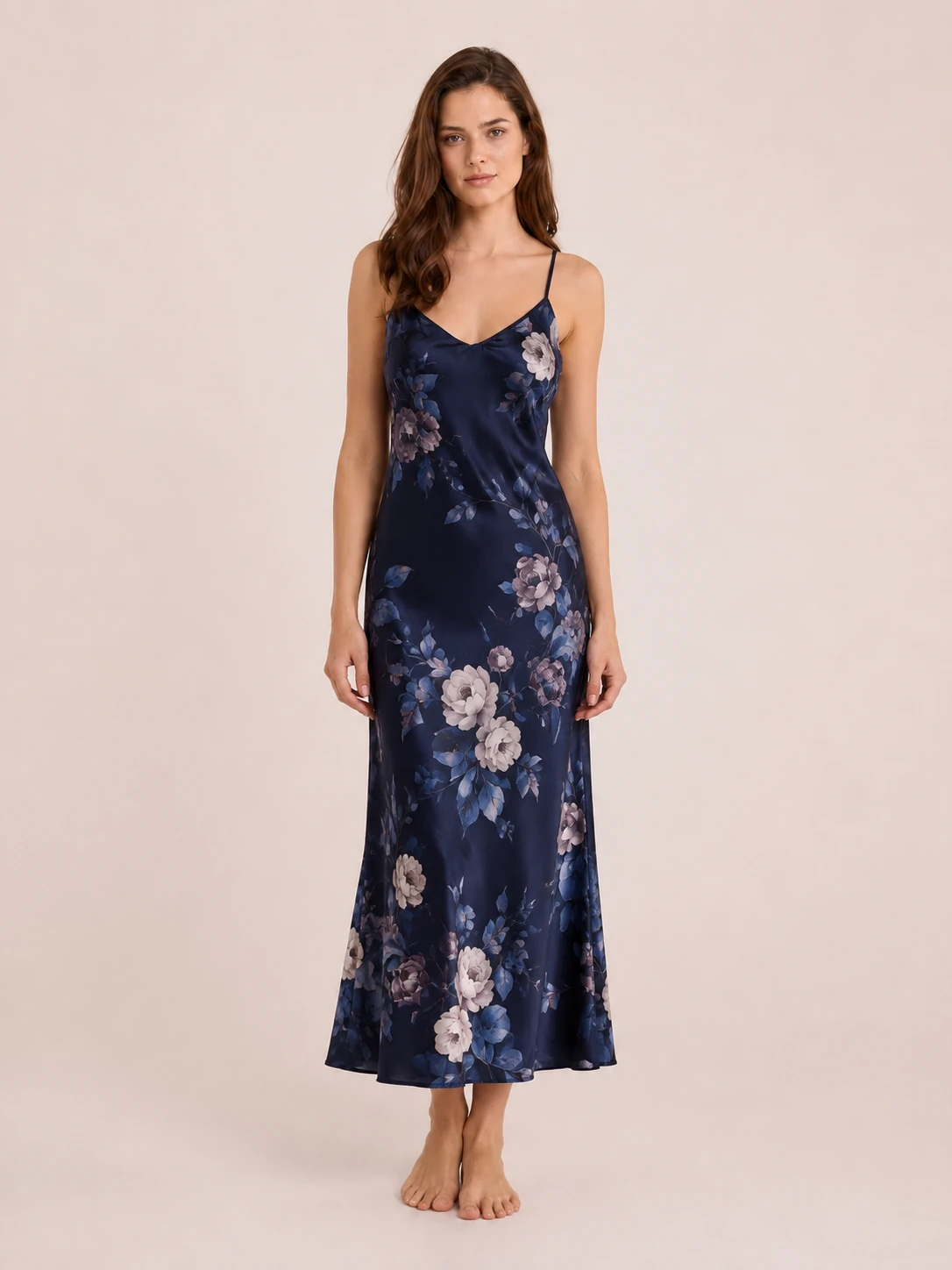 White silk wrap dress with soft leaf print pattern and elegant flowing design