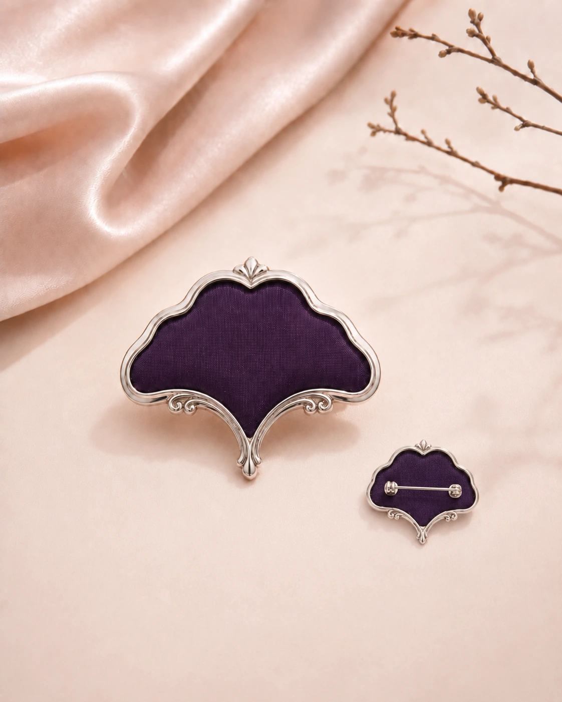 Vintage botanical-shaped purple silk brooch shown from the front and back with pin fastening